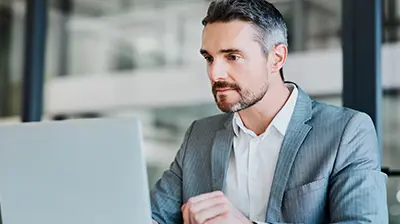 a businessman using a laptop 