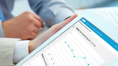 Two people reviewing analytics on a tablet